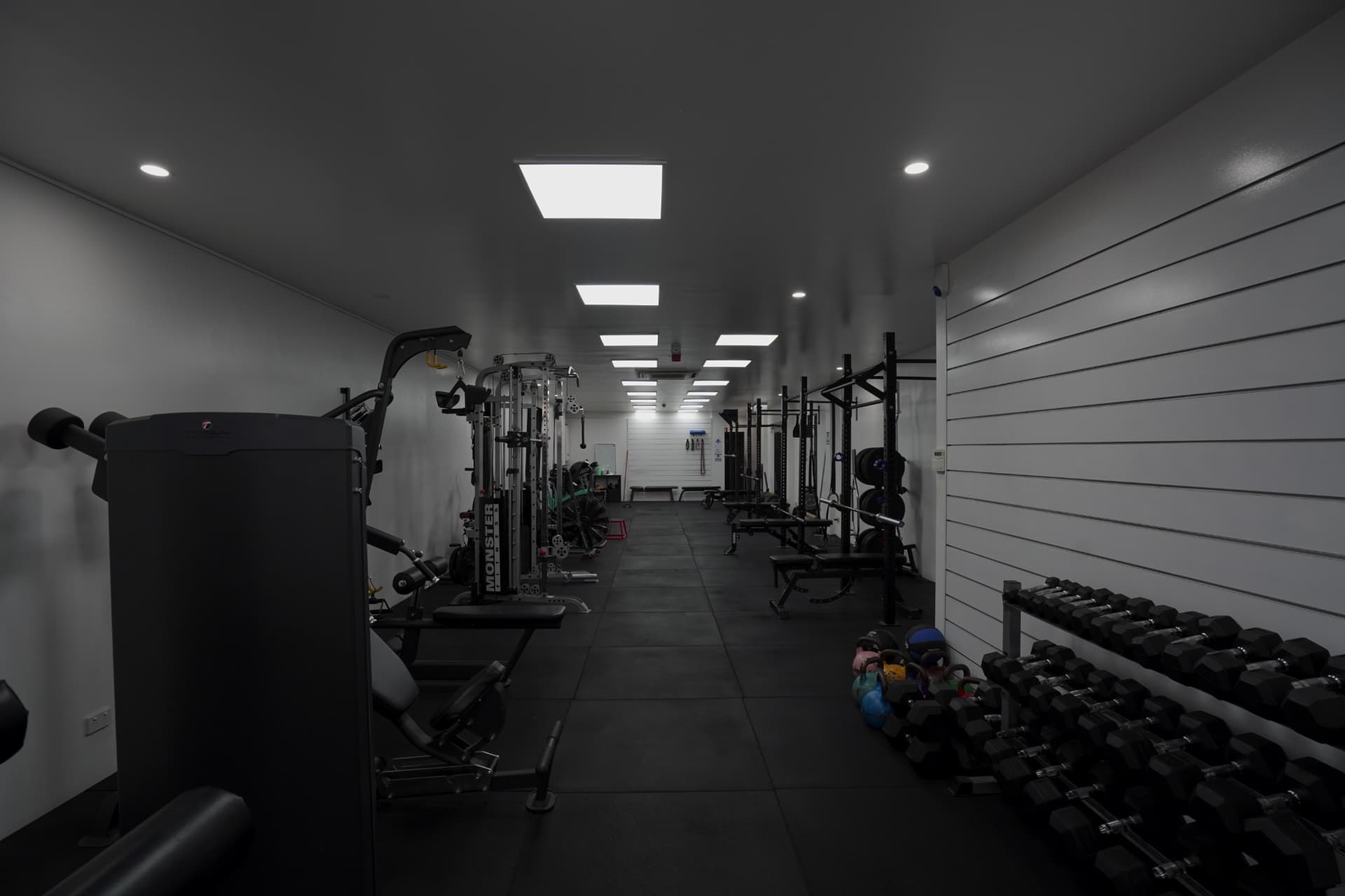 Dumbbells and racks along the training floor at PT Central, Crows Nest